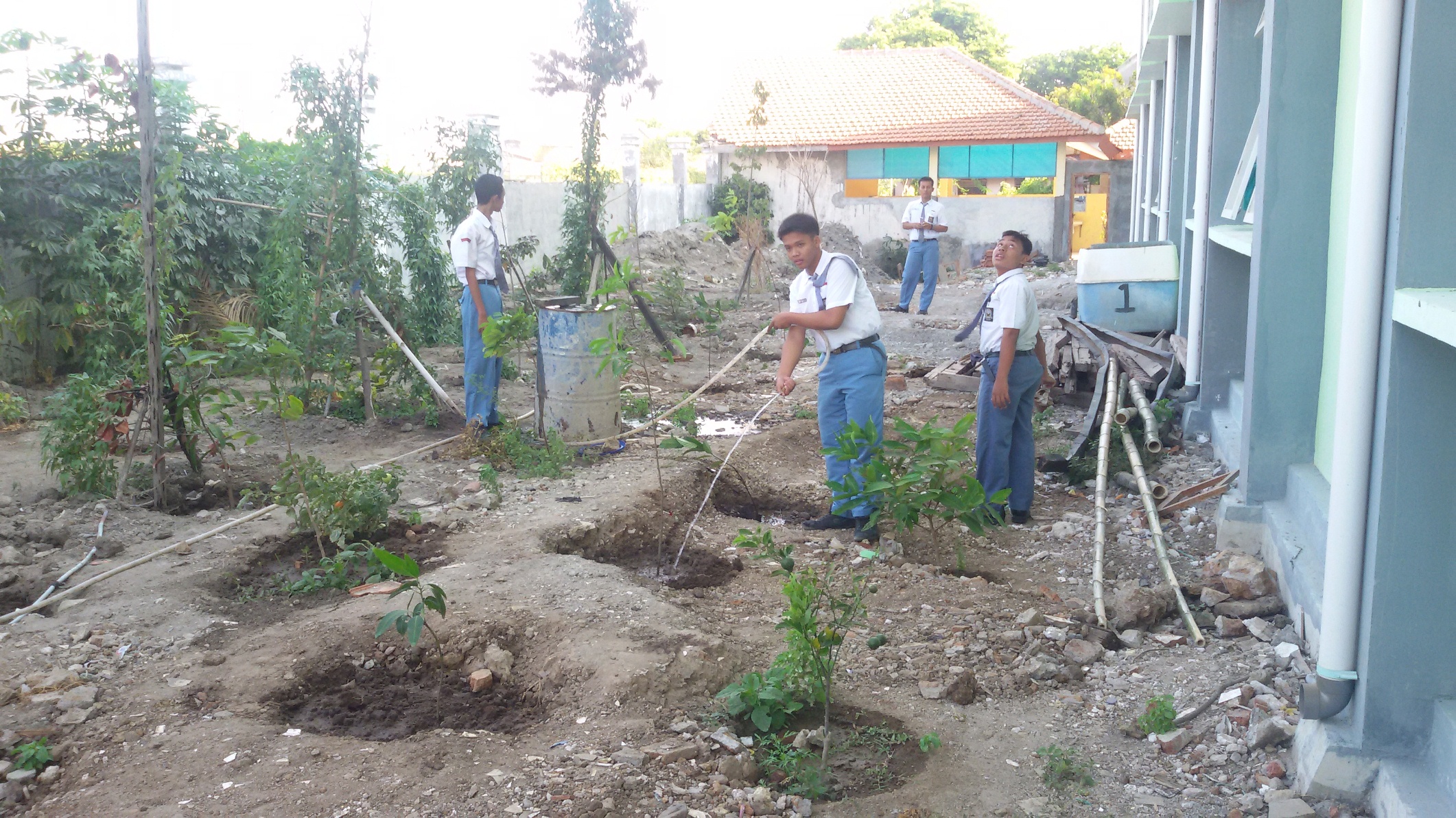 Students attending to a rehabilitated rubbish site beside their school - Credit: Kelsie Prabawa-Sear